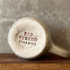 Speckled mug with words about work