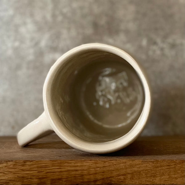 Ceramic mug with funny saying about money