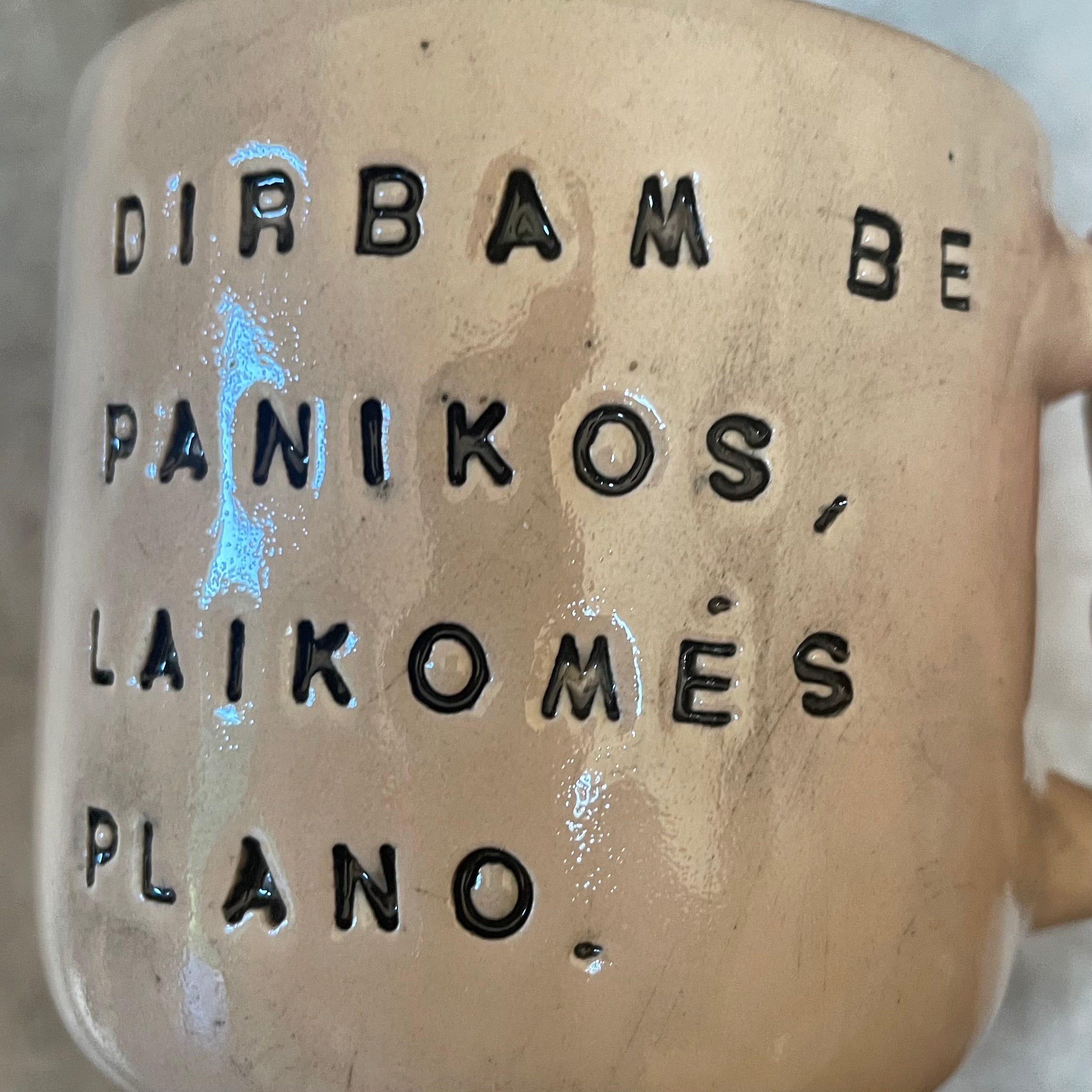Ceramic mug with words about work