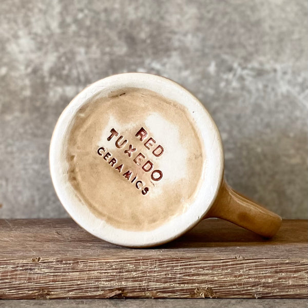 Brownish mug with good wishes