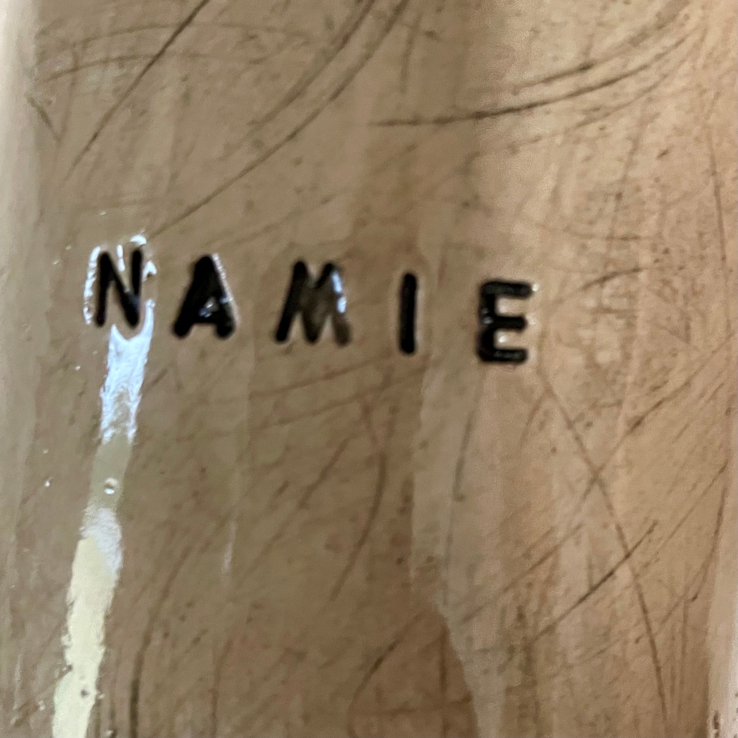 Beige mug with word in NAMIE