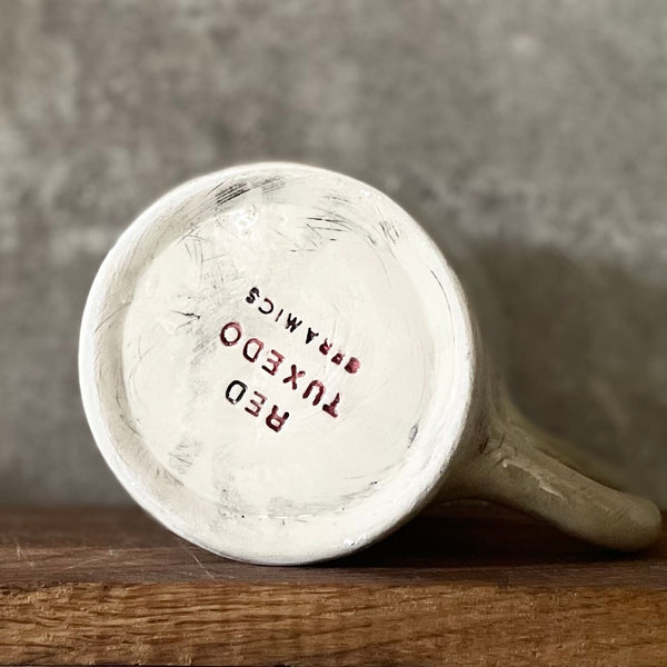 Big white ceramic mug about rest