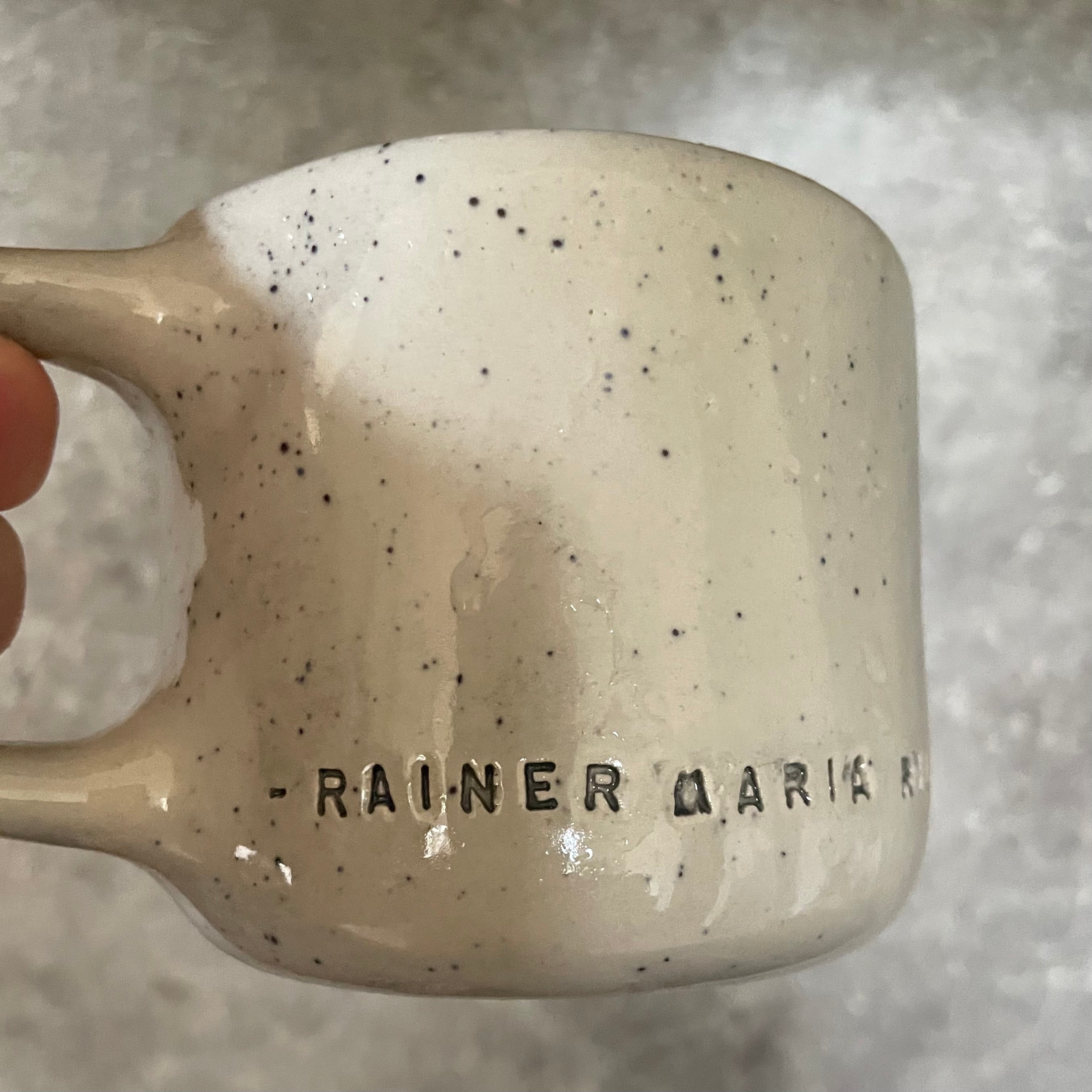 Ceramic mug with artist quote