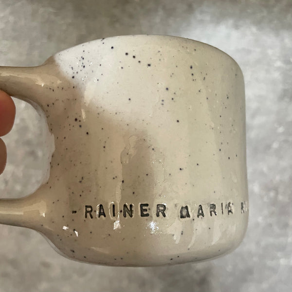 Ceramic mug with artist quote