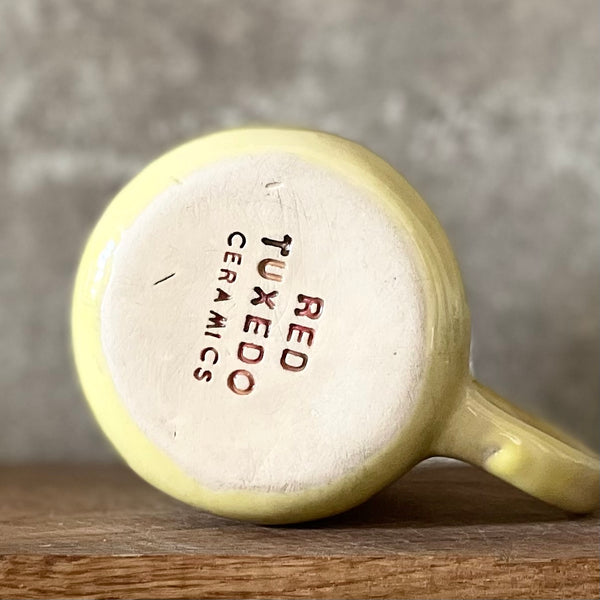 Yellow ceramic mug with saying in Russian