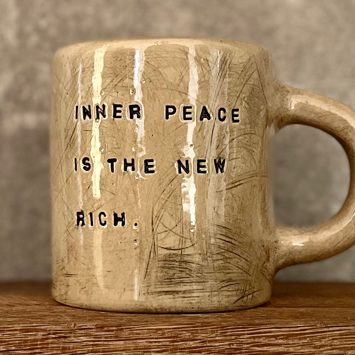 Beige large handmade ceramic mug with saying about peace