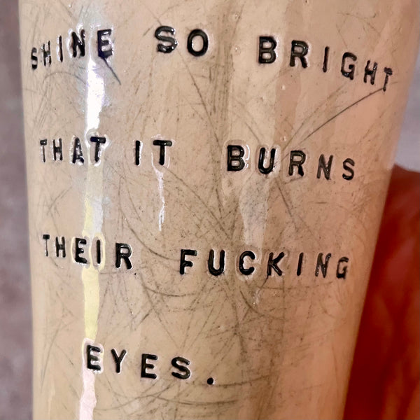 Bright yellow mug with saying