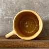 Yellow mug with optimistic text