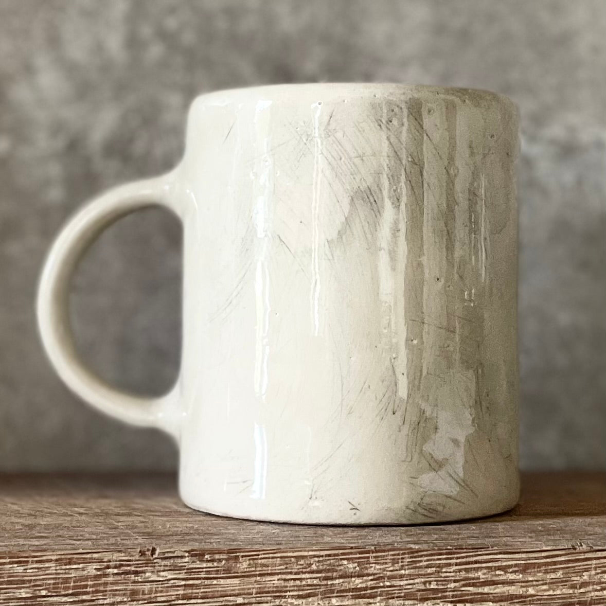 White ceramic mug with words about work