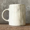 White ceramic mug with words about work
