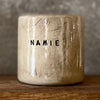 Beige mug with word in NAMIE