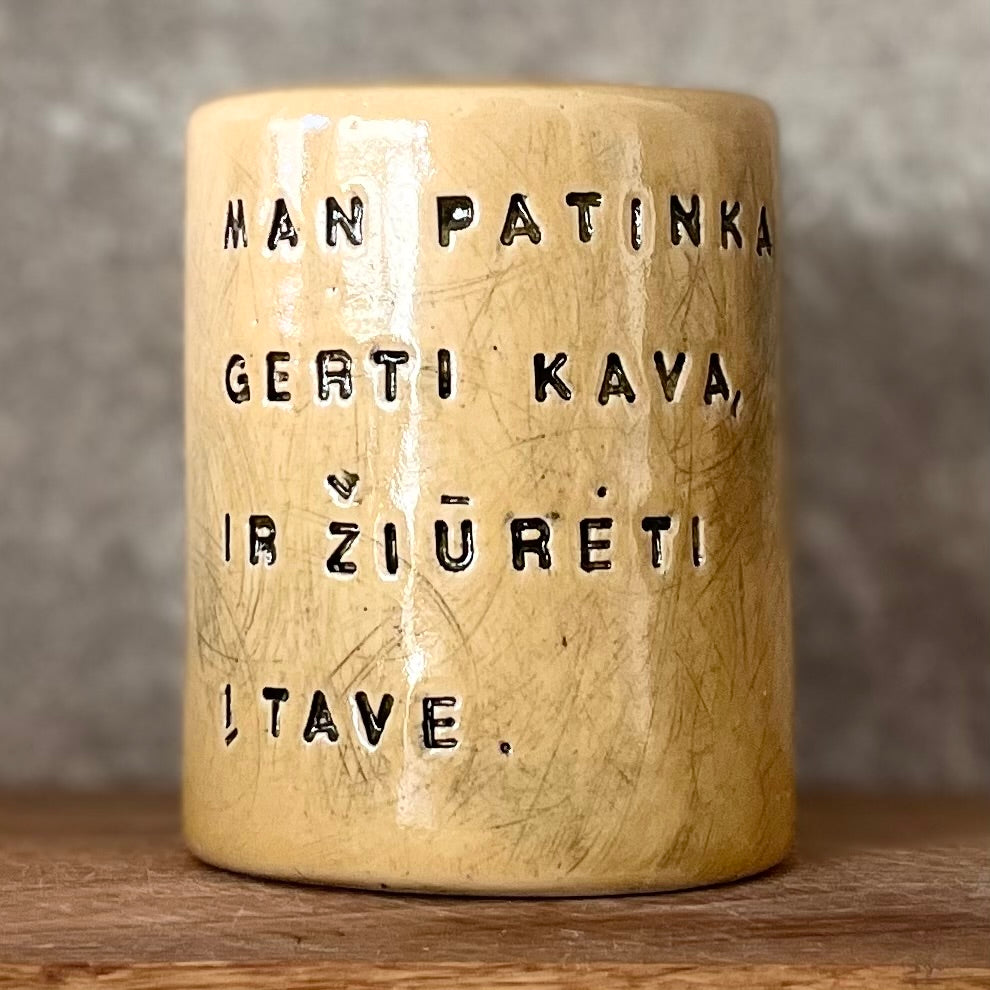 Yellow mug about coffee and you