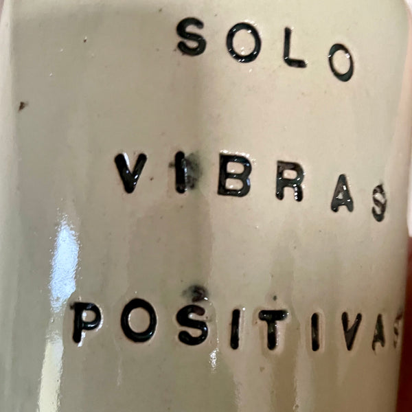 Pale blue mug with saying in Spanish
