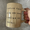 Beige mug with love saying in Lithuanian