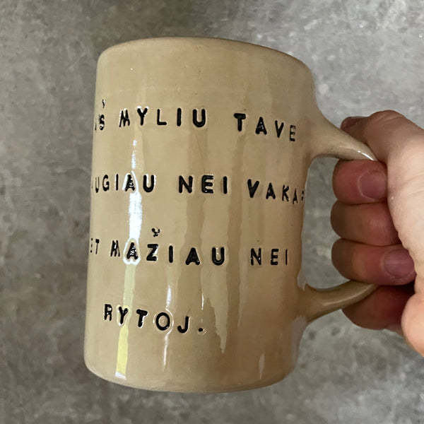 Beige mug with love saying in Lithuanian