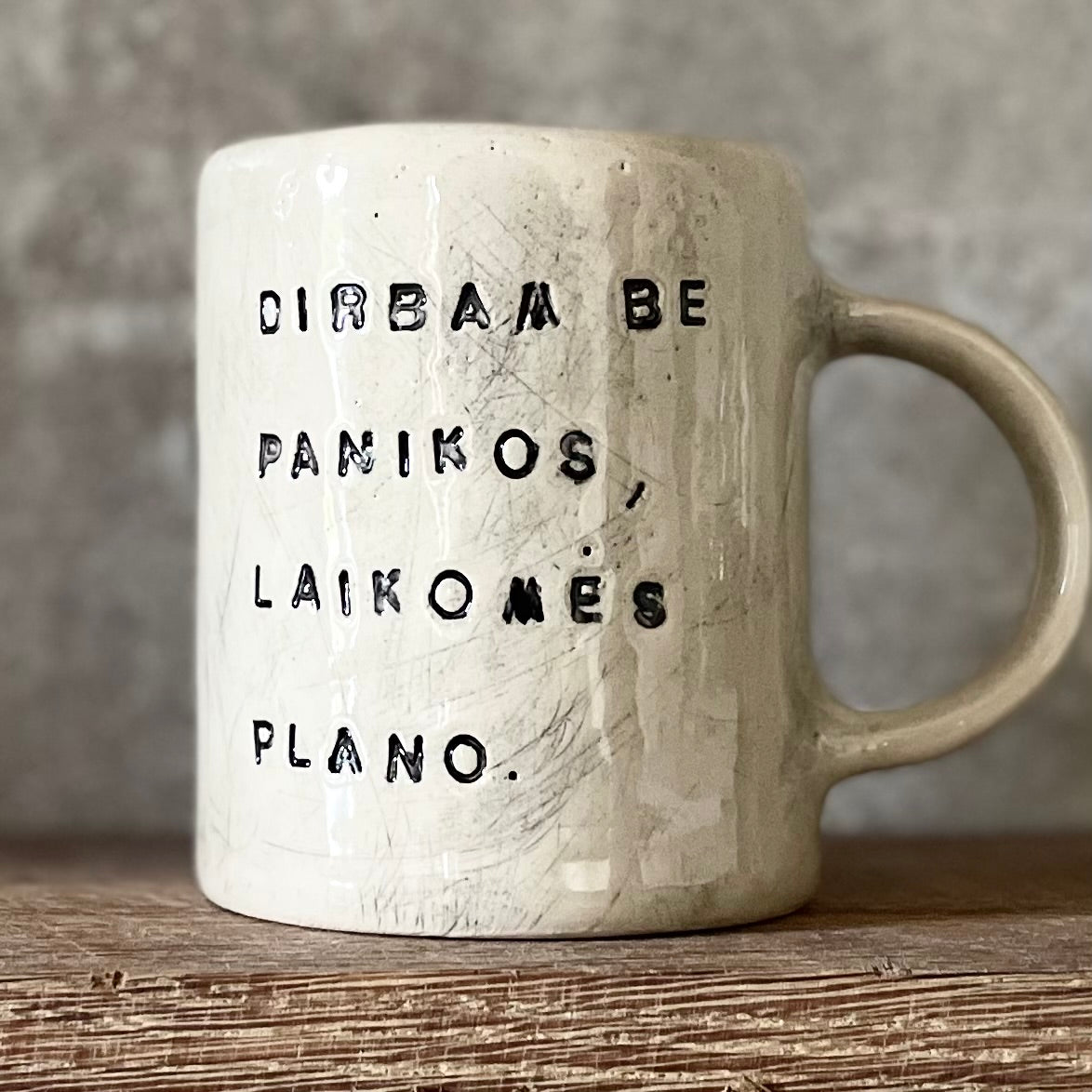 White ceramic mug with words about work