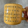 Yellow mug with optimistic text