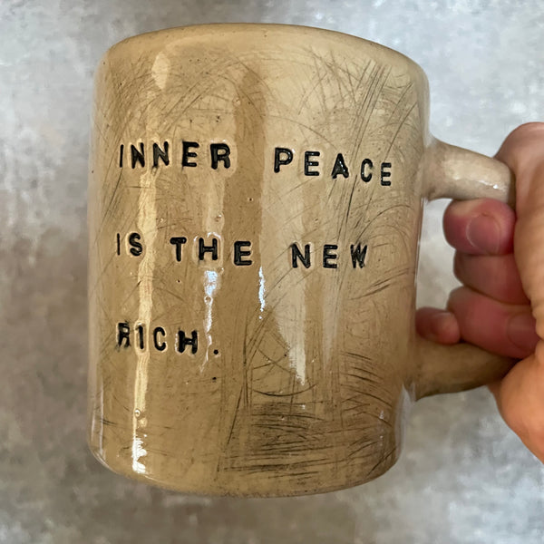 Beige large handmade ceramic mug with saying about peace