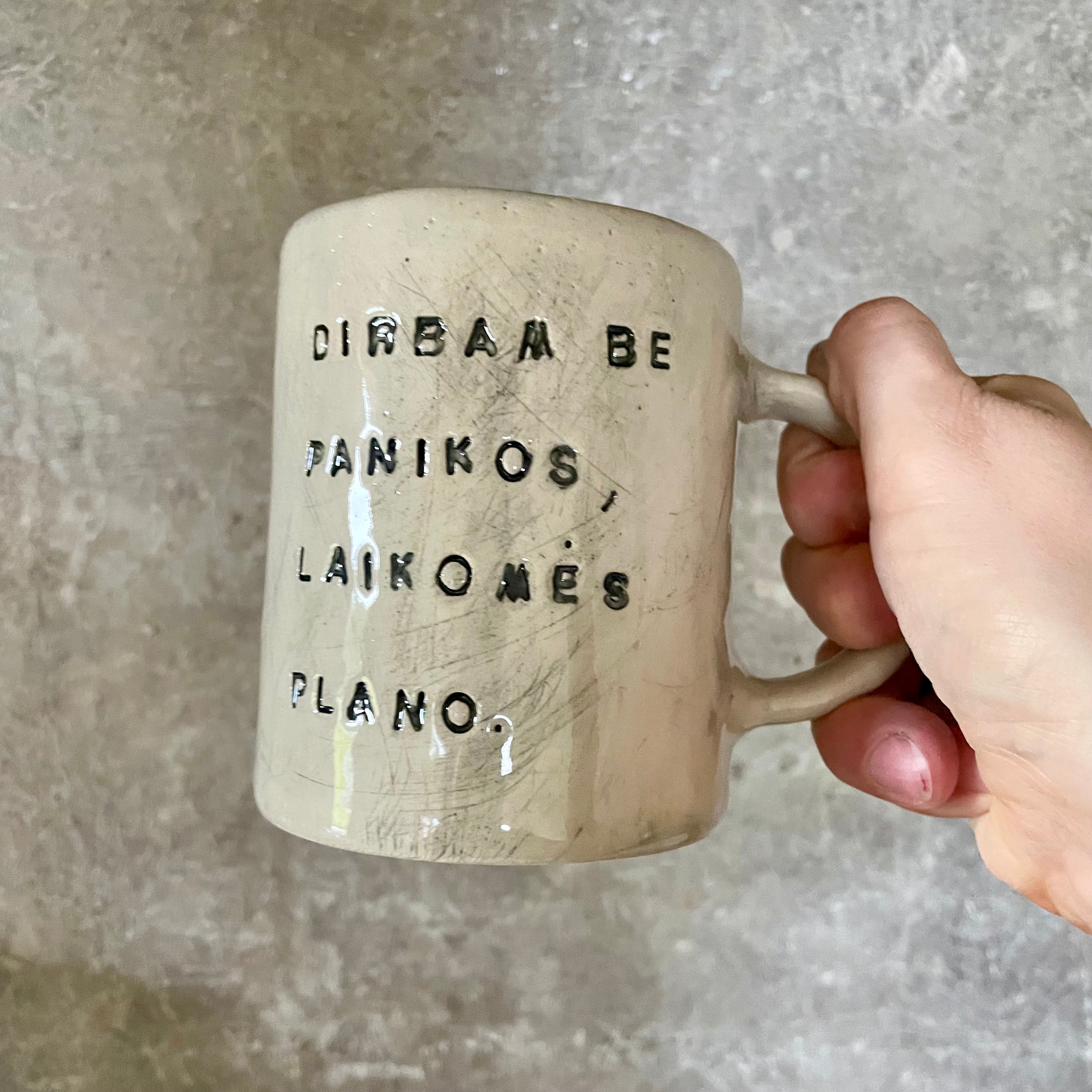White ceramic mug with words about work