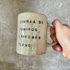 White ceramic mug with words about work