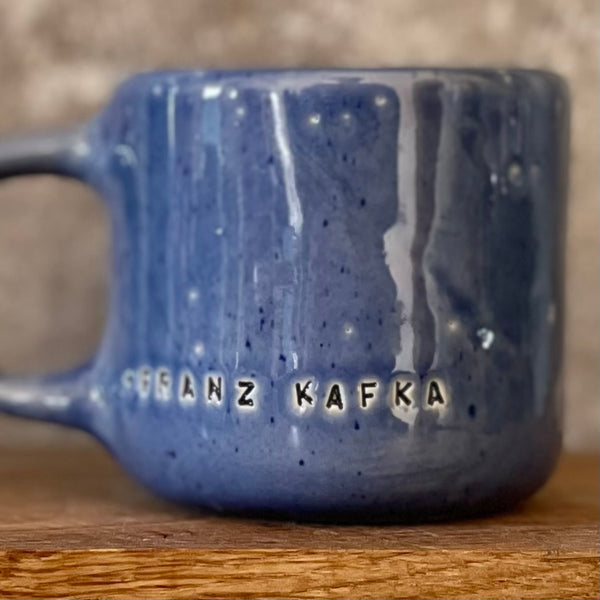 Blue coffee mug with quote by Kafka
