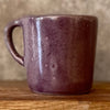 Small purple mug with words in Lithuanian
