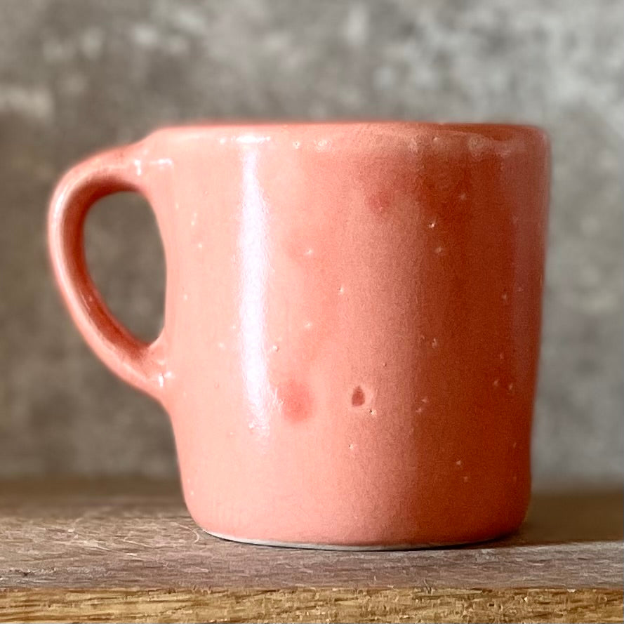 Small pink mug with funny phrase in Lithuanian