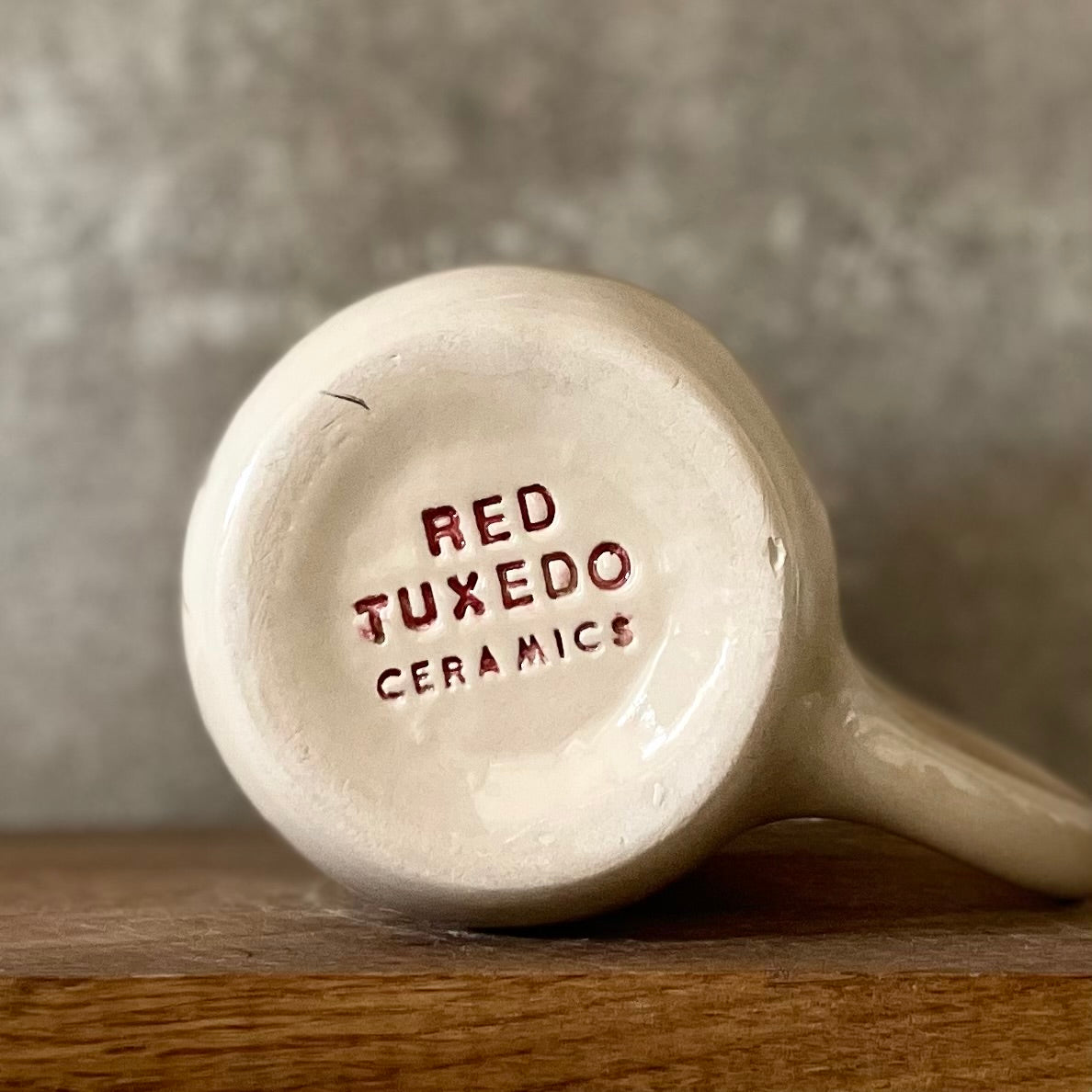 Ceramic mug with money saying