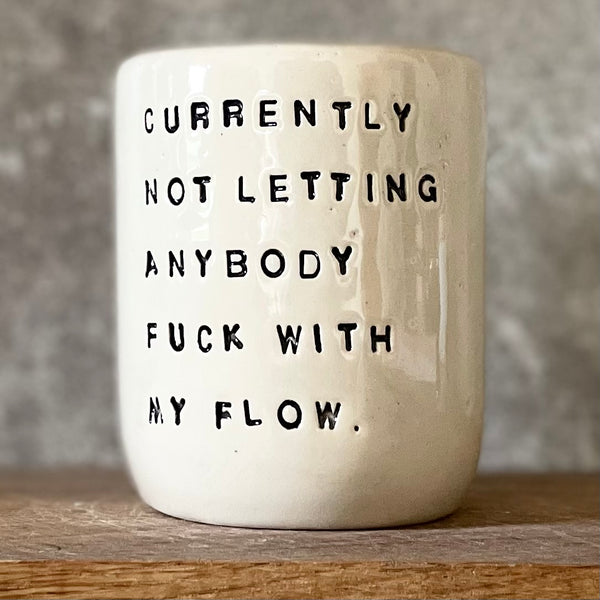 Ceramic coffee mug with saying about the flow
