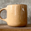 Caramel mug with words about work