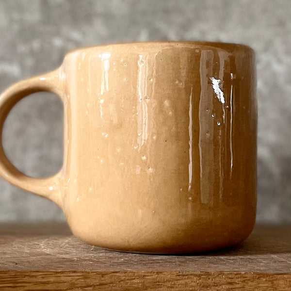 Caramel mug with words about work