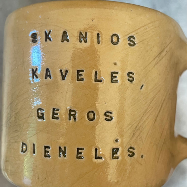 Yellow mug with good wishes