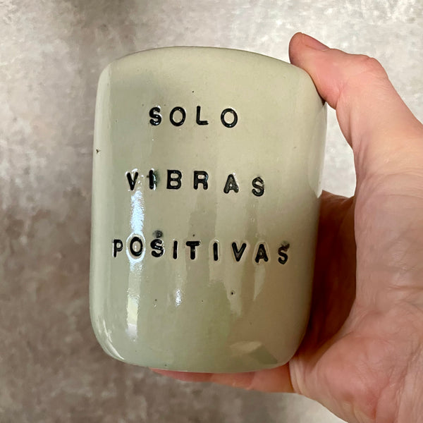 Pale blue mug with saying in Spanish