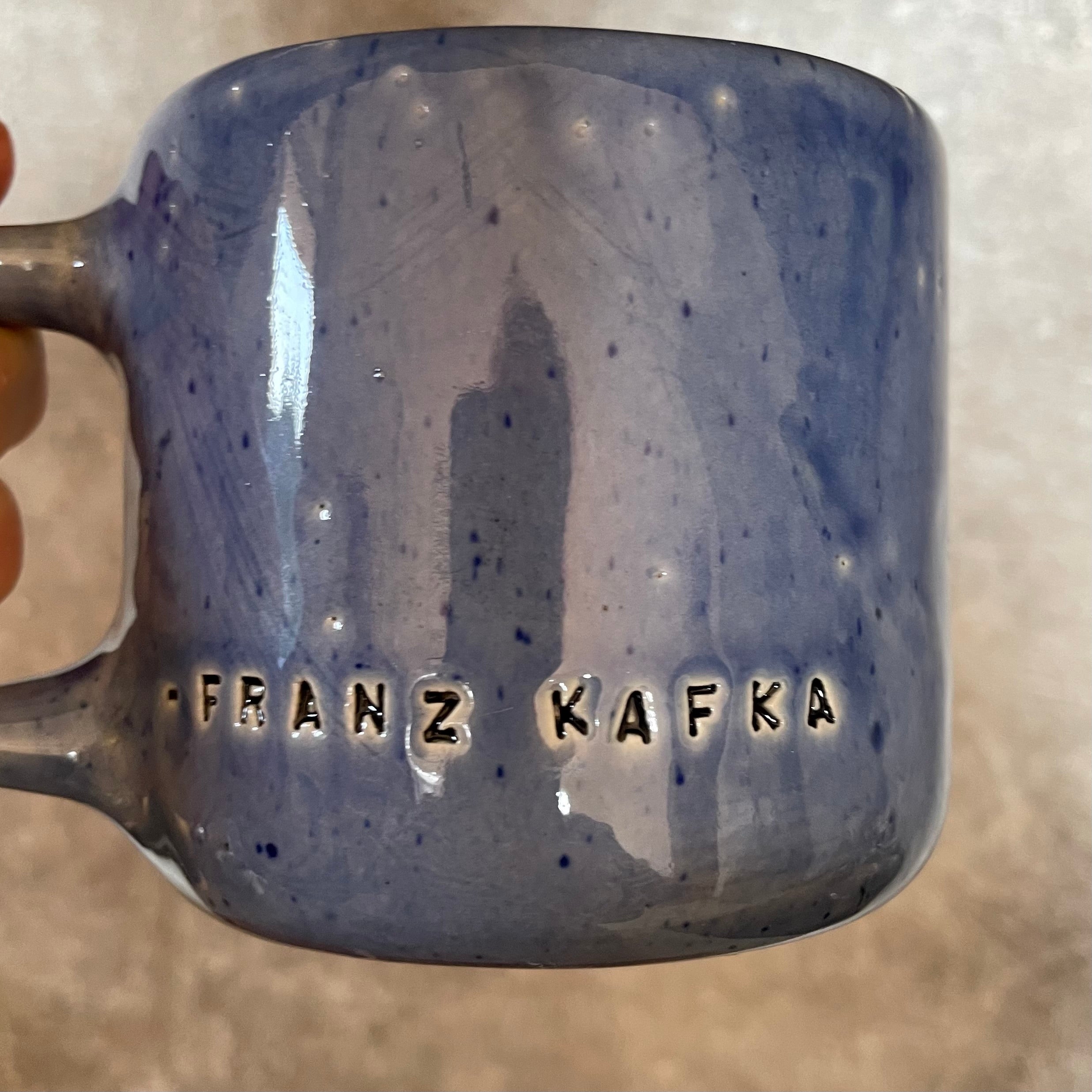 Blue coffee mug with quote by Kafka