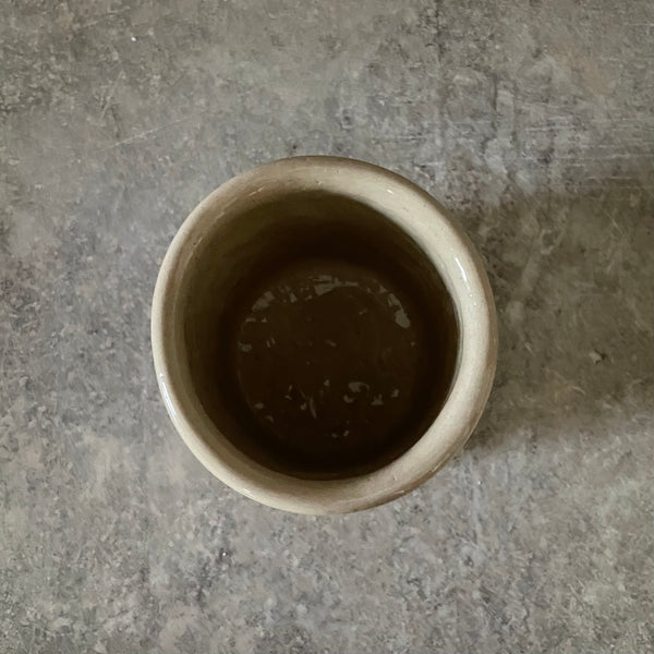 Beige tumbler mug with word RAMYBE