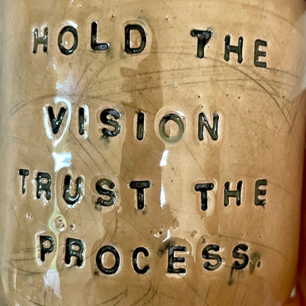 Bright yellow tumbler mug with inspirational words