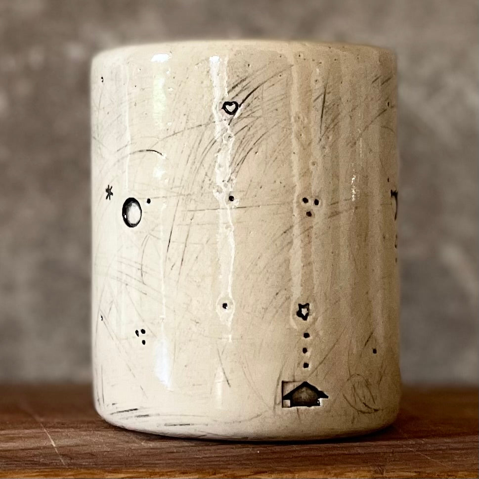 White mug with magic saying