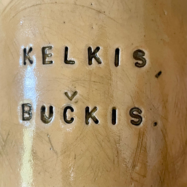 Big yellow mug with saying in Lithuanian