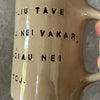 Beige mug with love saying in Lithuanian