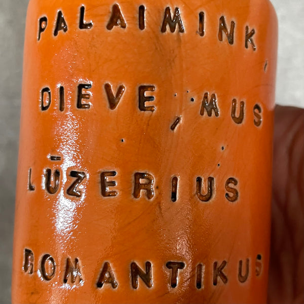 Bright orange mug with blessing