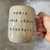 Speckled mug with saying in Lithuanian