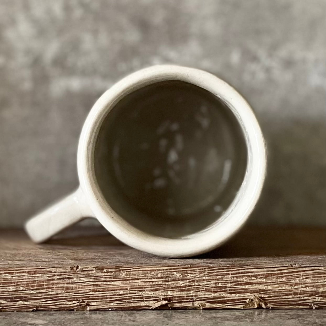 White ceramic mug with words about work