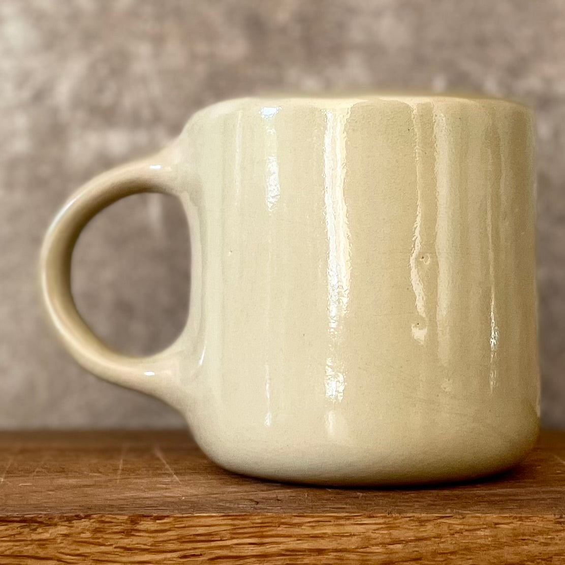 Beige mug with quote