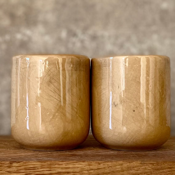 Brownish small mugs without handle with sentimental text