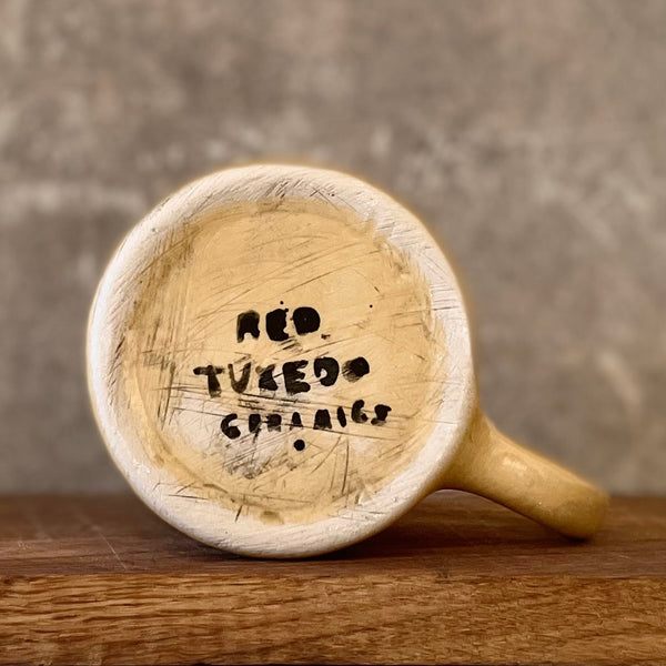 Yellow mug with good wishes