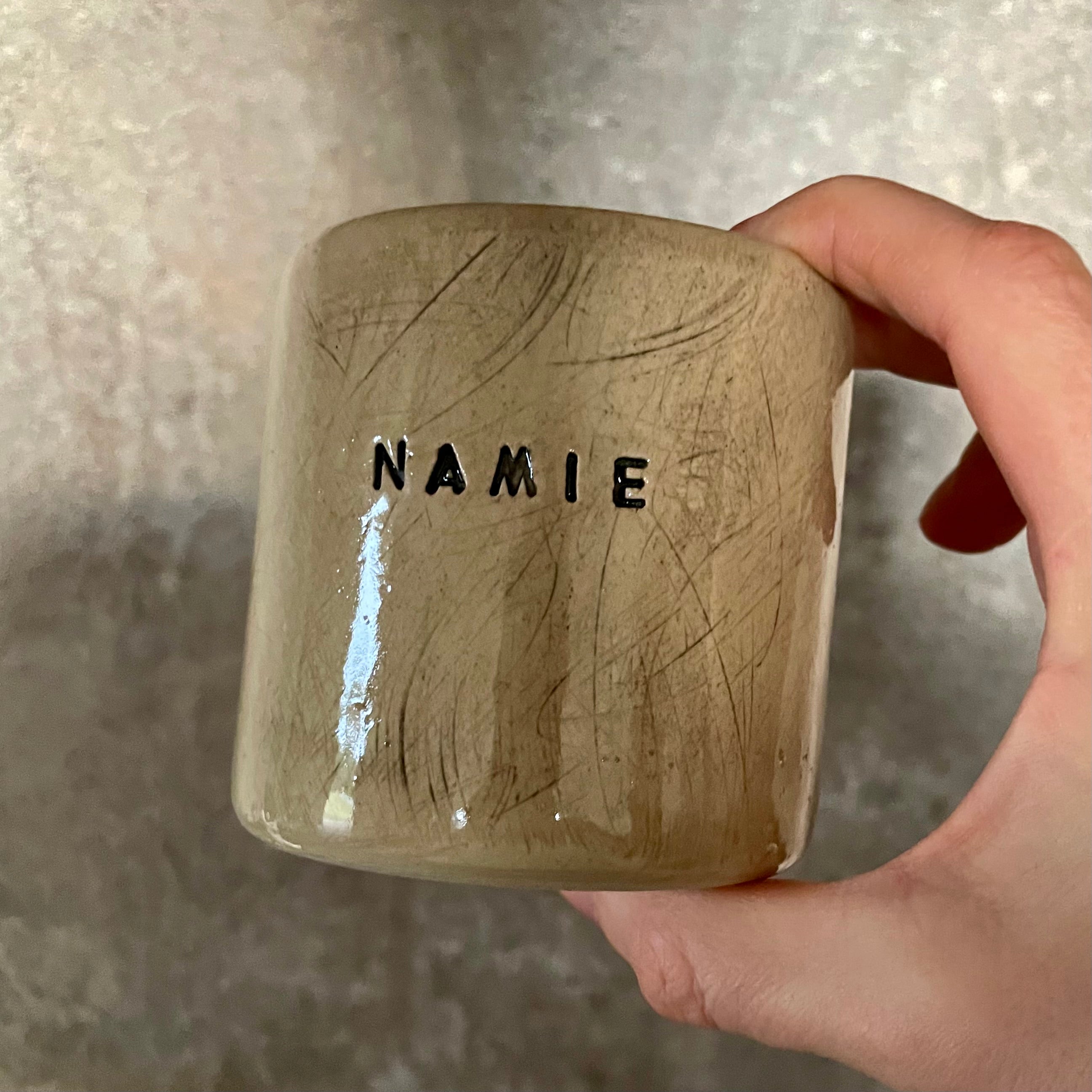 Beige mug with word in NAMIE