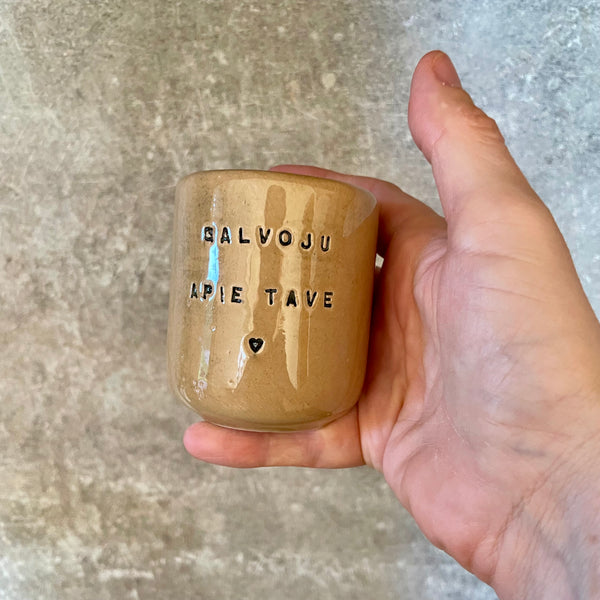 Brownish small mugs without handle with sentimental text