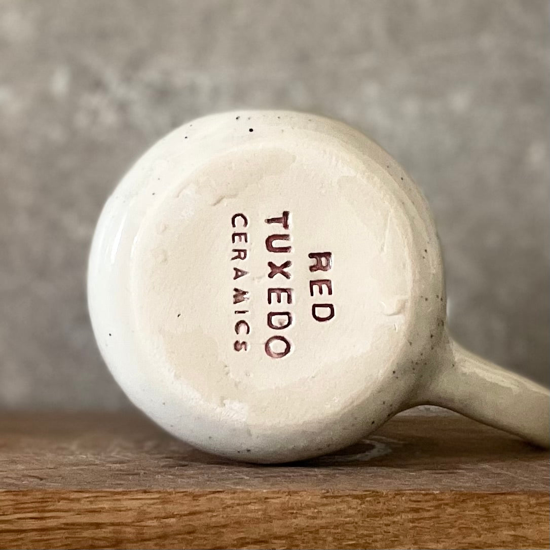 Ceramic mug with artist quote