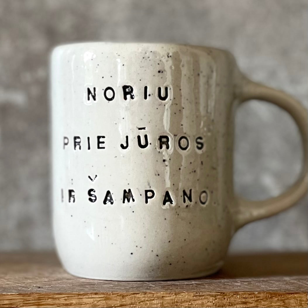 Speckled mug with saying in Lithuanian