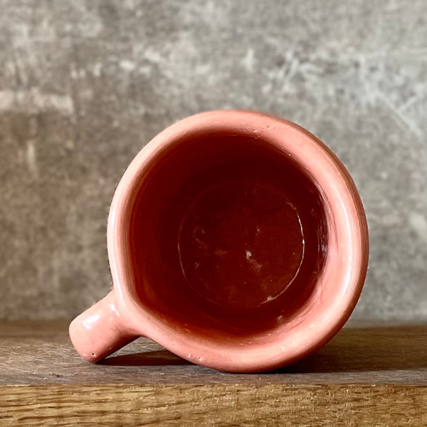 Small pink mug with funny phrase in Lithuanian